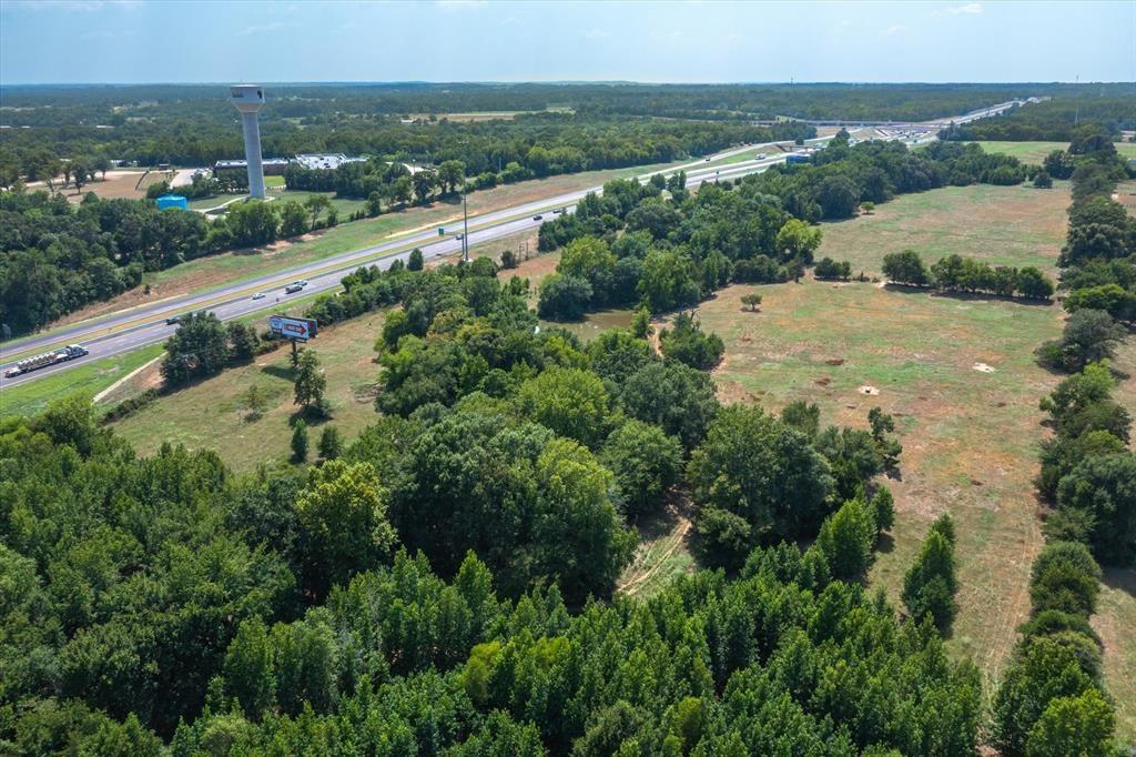 20 Interstate 20 Lindale, TX 75706 - Photo 17 of 22 an aerial view of residential houses with outdoor space and trees