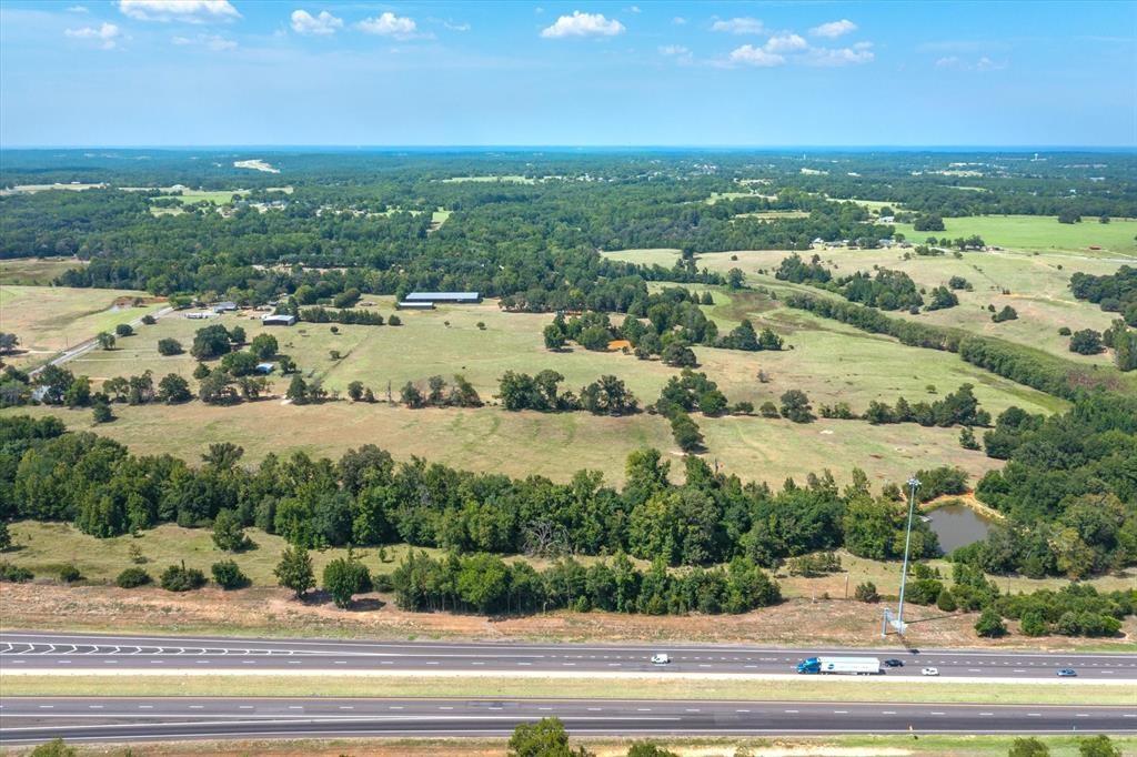 20 Interstate 20 Lindale, TX 75706 - Photo 21 of 22 an aerial view of a houses with a yard and lake view