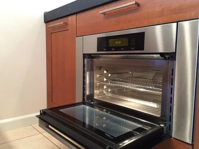 a bedroom with a bed and a night stand