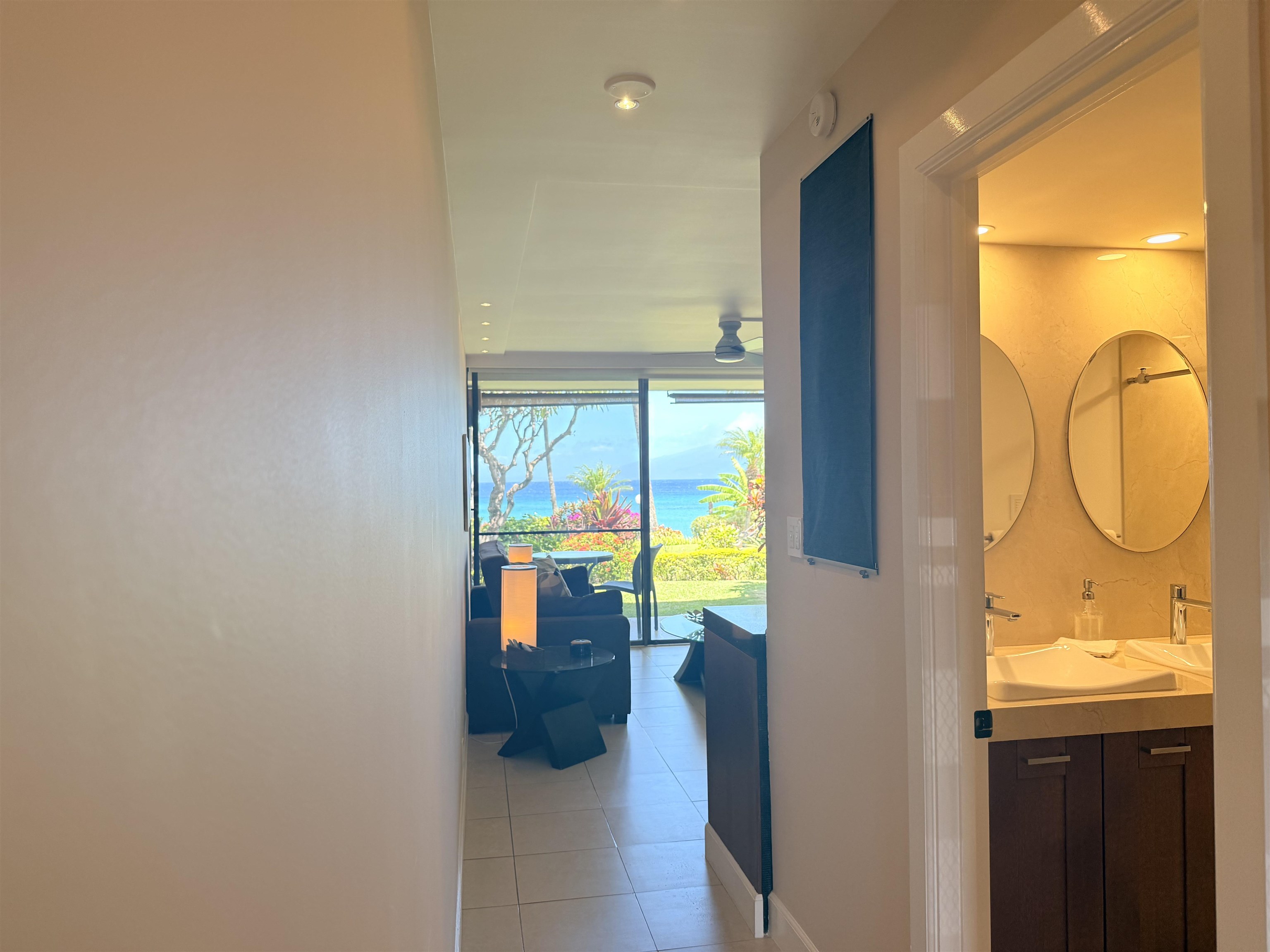 3959 Lower Honoapiilani Road, Unit 503 Lahaina, HI 96761 - Photo 17 of 47 a bathroom with a tub and a large window