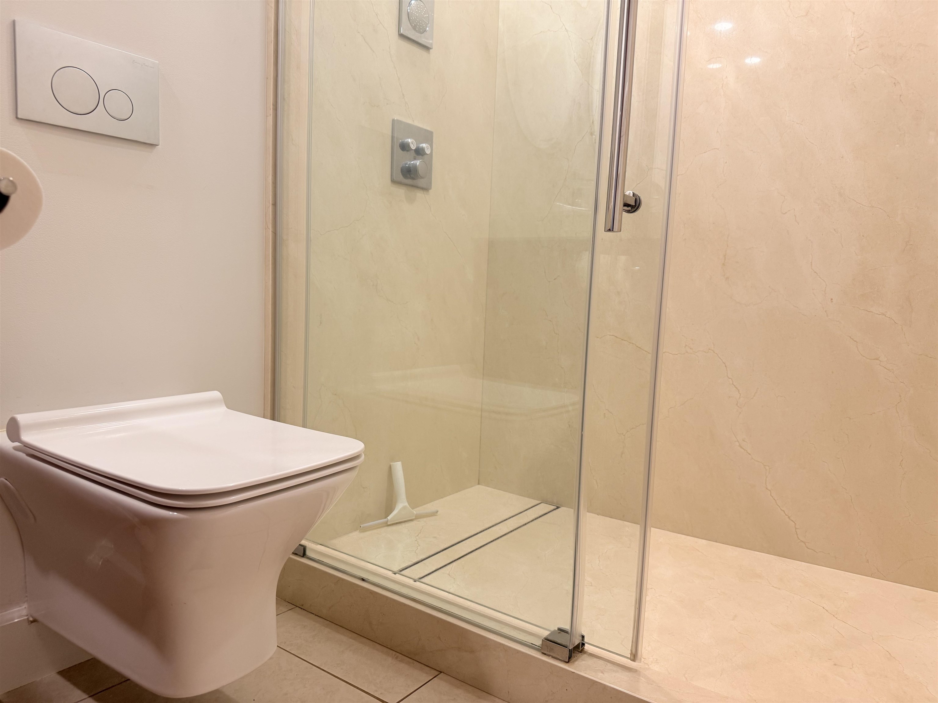 3959 Lower Honoapiilani Road, Unit 503 Lahaina, HI 96761 - Photo 22 of 47 a white toilet sitting next to a shower