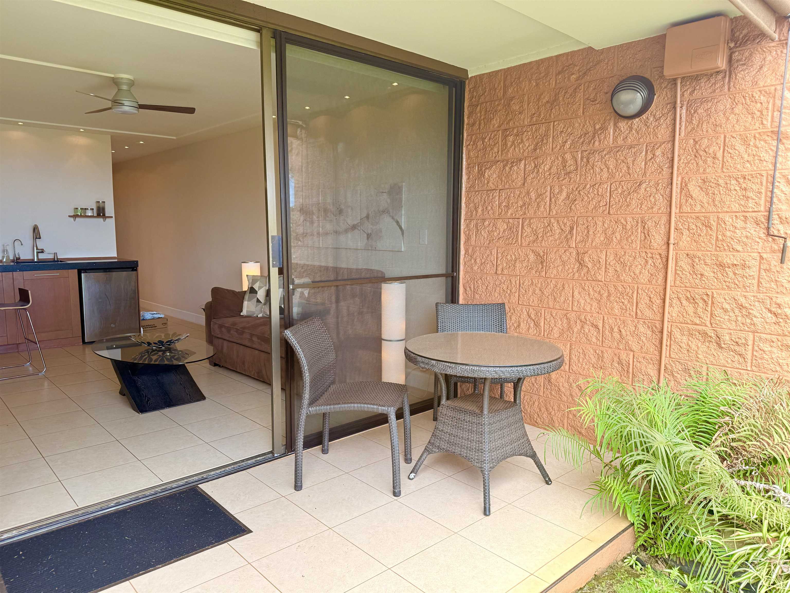 3959 Lower Honoapiilani Road, Unit 503 Lahaina, HI 96761 - Photo 26 of 47 a view of a dining room with furniture and a potted plant