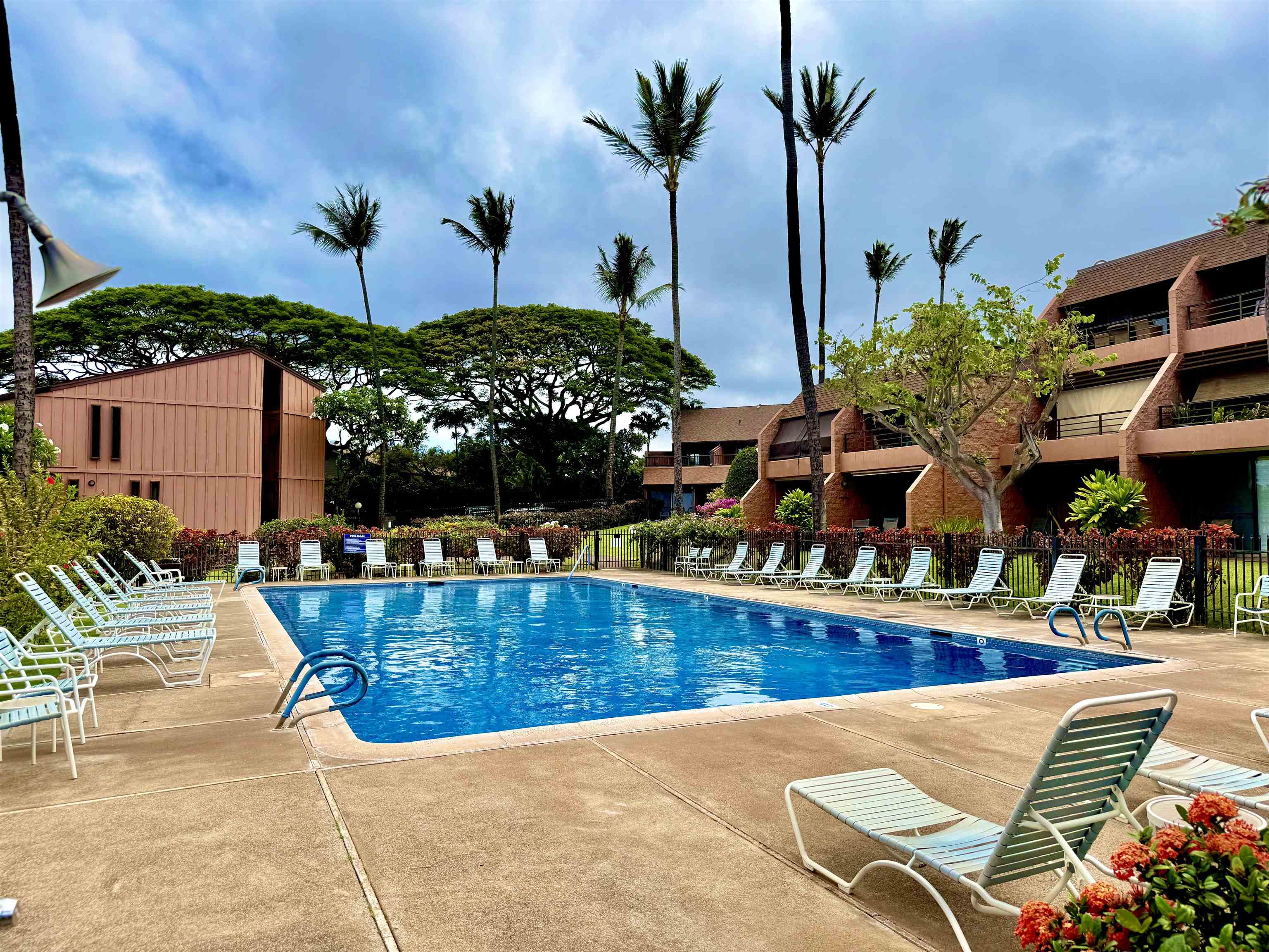 3959 Lower Honoapiilani Road, Unit 503 Lahaina, HI 96761 - Photo 32 of 47 a view of swimming pool with outdoor seating and potted plants