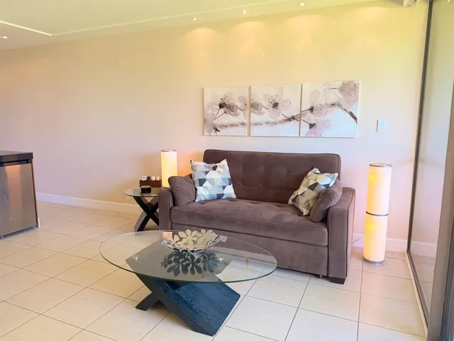 a living room with furniture and a table