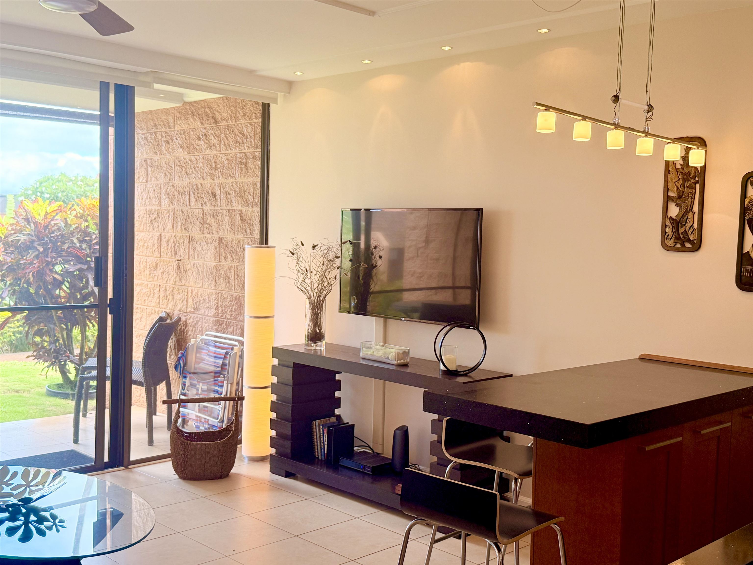 3959 Lower Honoapiilani Road, Unit 503 Lahaina, HI 96761 - Photo 9 of 47 a view of a workspace with furniture and floor to ceiling window