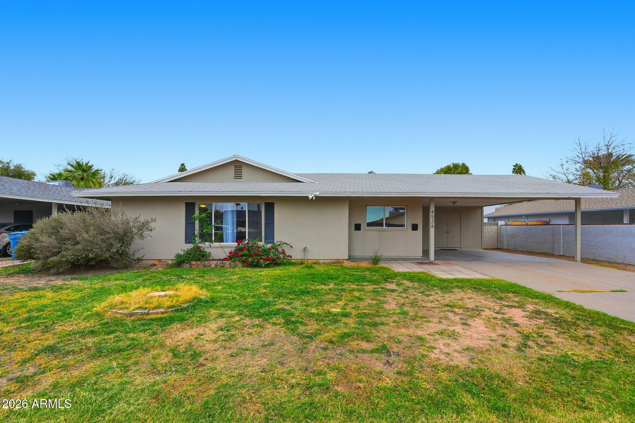 4526 South Terrace Road Tempe, AZ 85282 - Photo 1 of 30 a view of a house with a yard and sitting area
