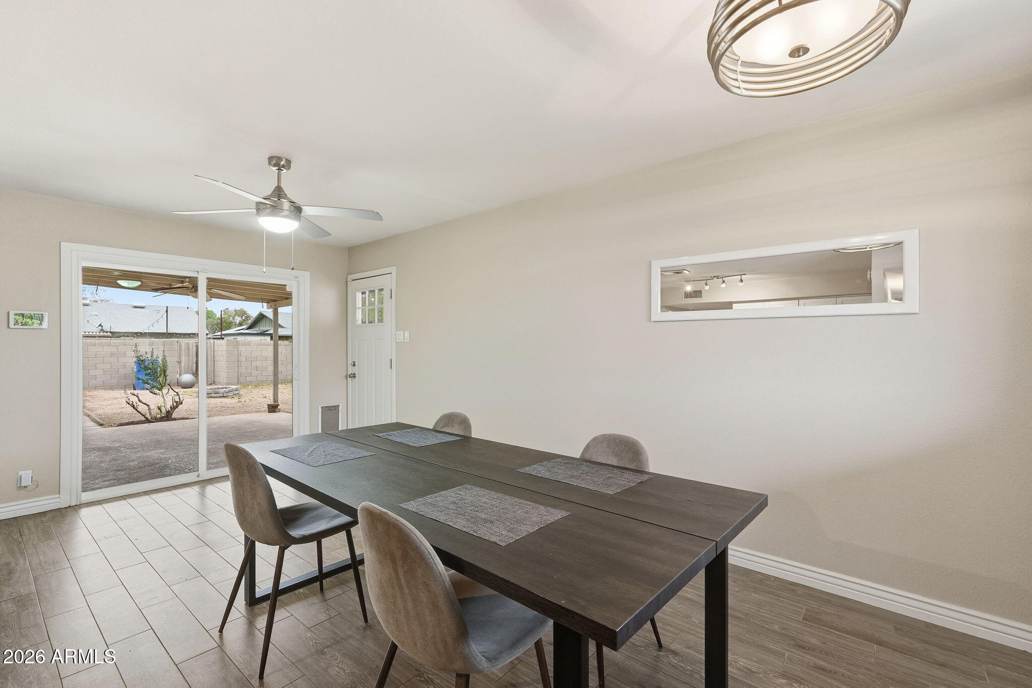 4526 South Terrace Road Tempe, AZ 85282 - Photo 11 of 30 a view of a dining room with furniture and wooden floor