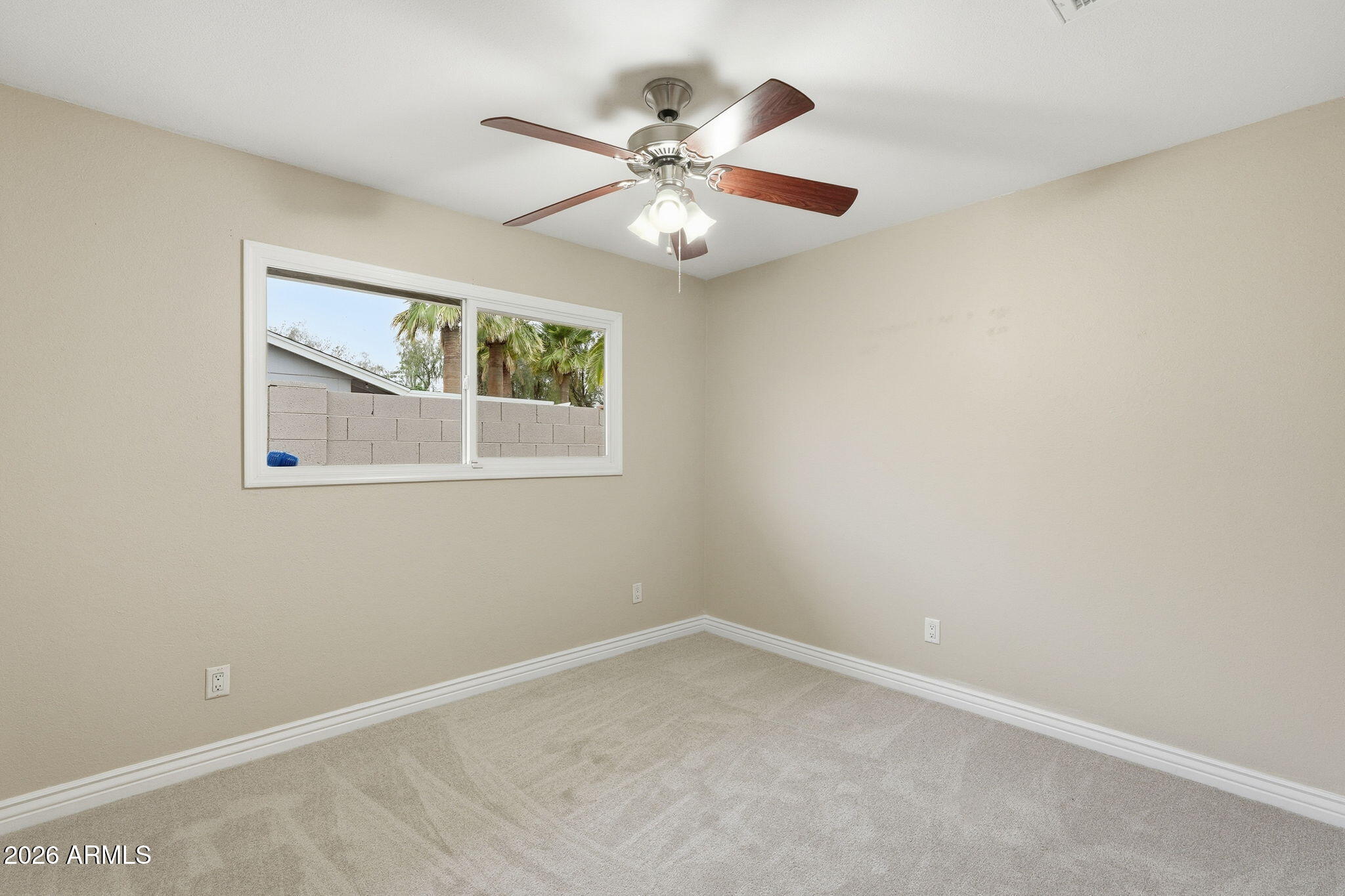 4526 South Terrace Road Tempe, AZ 85282 - Photo 20 of 30 an empty room with a window and a fan