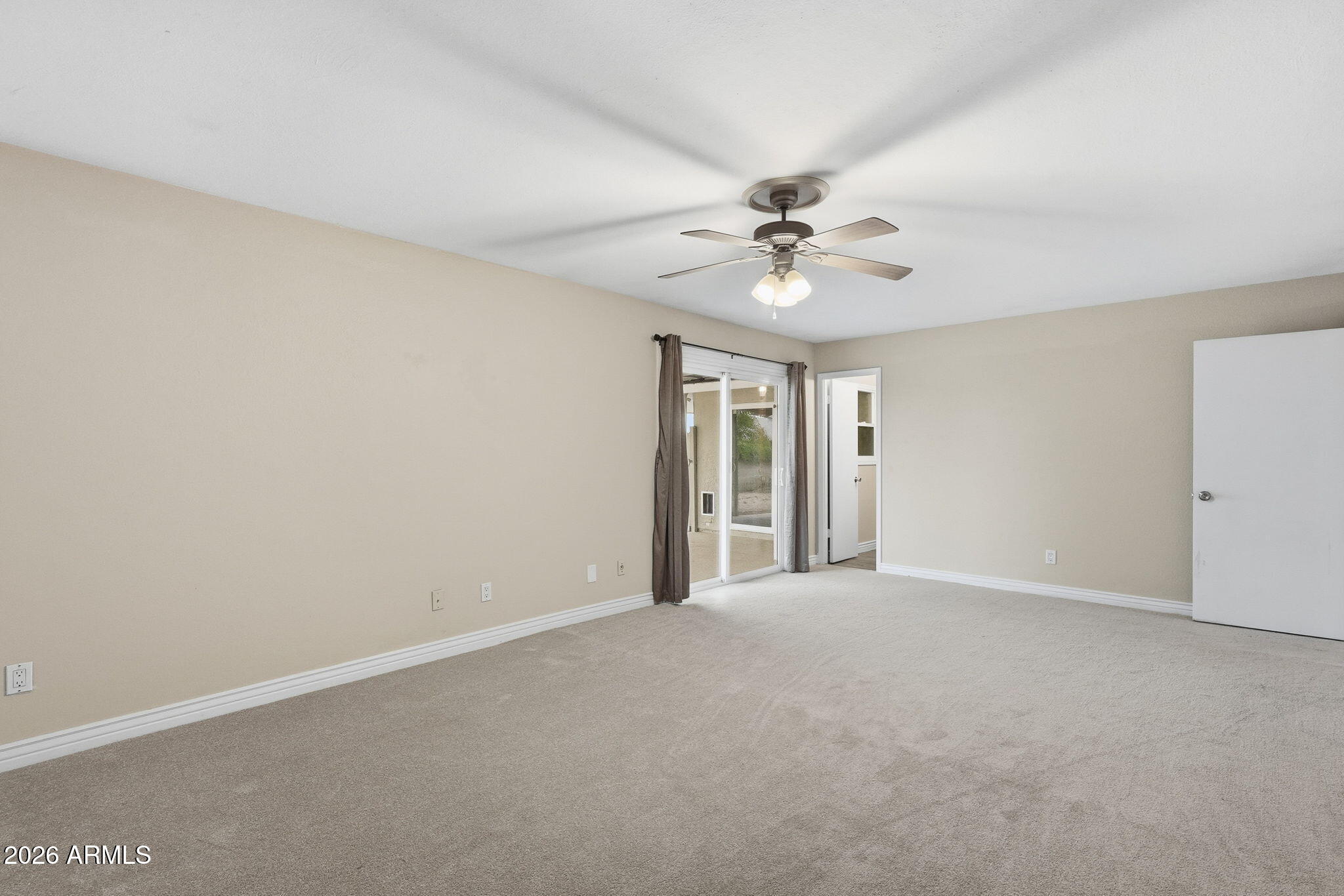 4526 South Terrace Road Tempe, AZ 85282 - Photo 23 of 30 a view of an empty room with a ceiling fan