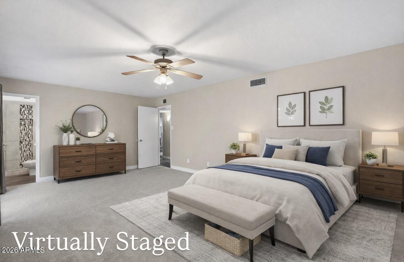 4526 South Terrace Road Tempe, AZ 85282 - Photo 24 of 30 a bedroom with a bed a dresser and potted plants