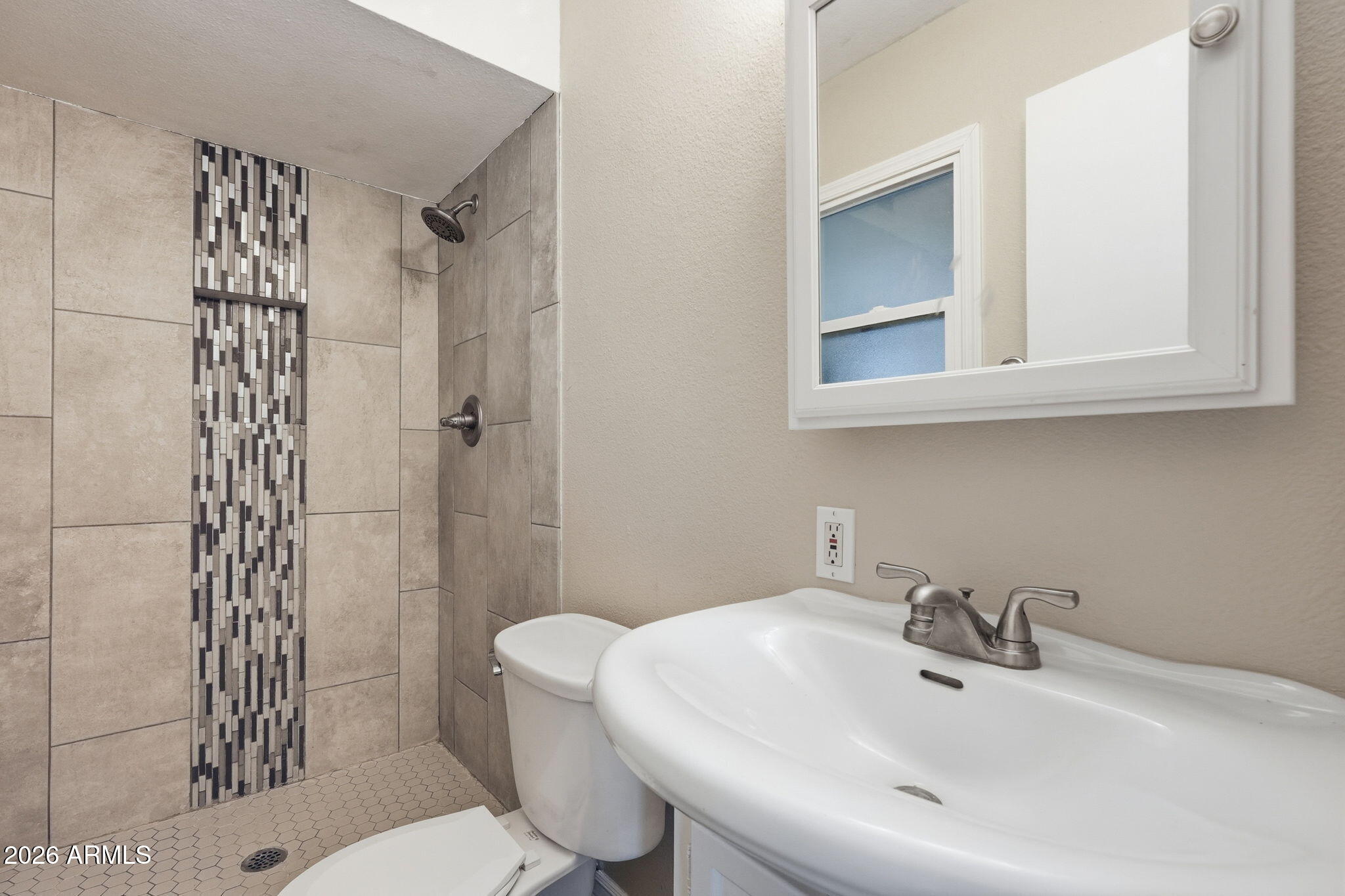 4526 South Terrace Road Tempe, AZ 85282 - Photo 26 of 30 a bathroom with a sink toilet and shower