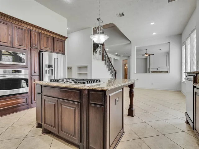 a kitchen with a stove and a sink