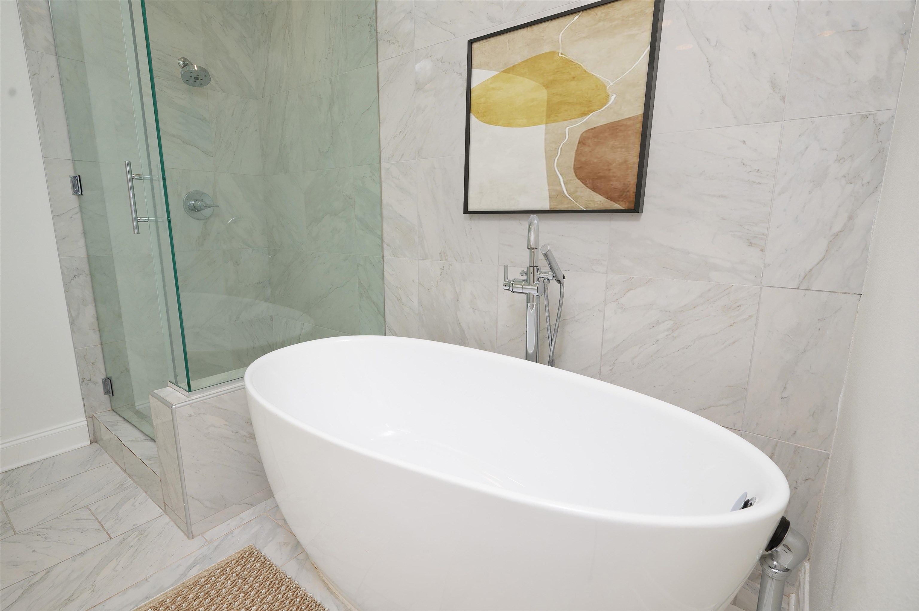717 Riverside Drive, Unit 1108 Memphis, TN 38103 - Photo 16 of 39 a white bath tub sitting in a bathroom