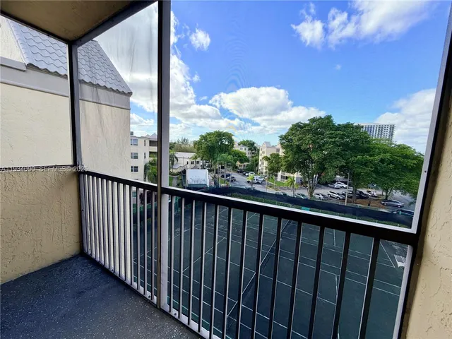 a view of balcony with a potted plant