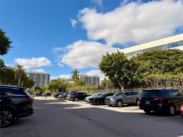 a view of street with parked cars