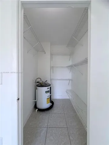 a view of storage and utility room with a utility room