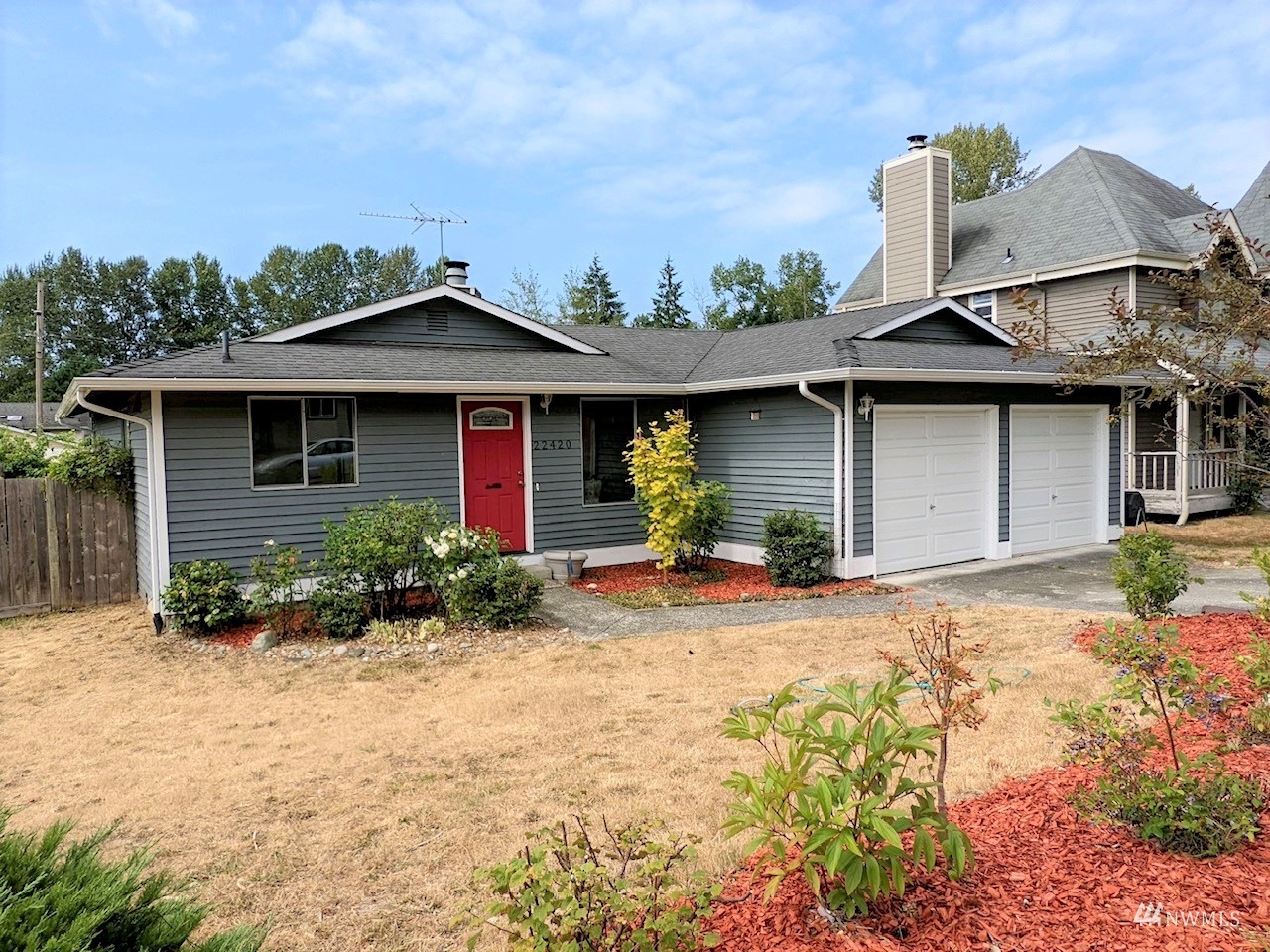 22420 13th Place West Bothell, WA 98021 - Photo 1 of 19 a front view of a house with a yard