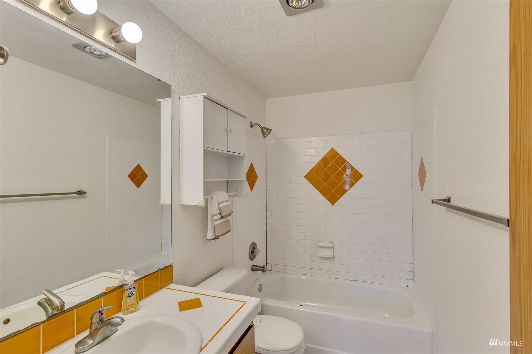 22420 13th Place West Bothell, WA 98021 - Photo 11 of 19 a bathroom with a sink a toilet and shower