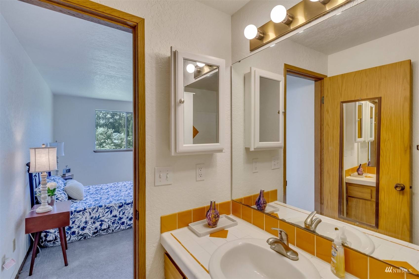 22420 13th Place West Bothell, WA 98021 - Photo 12 of 19 a bathroom with a sink and a mirror