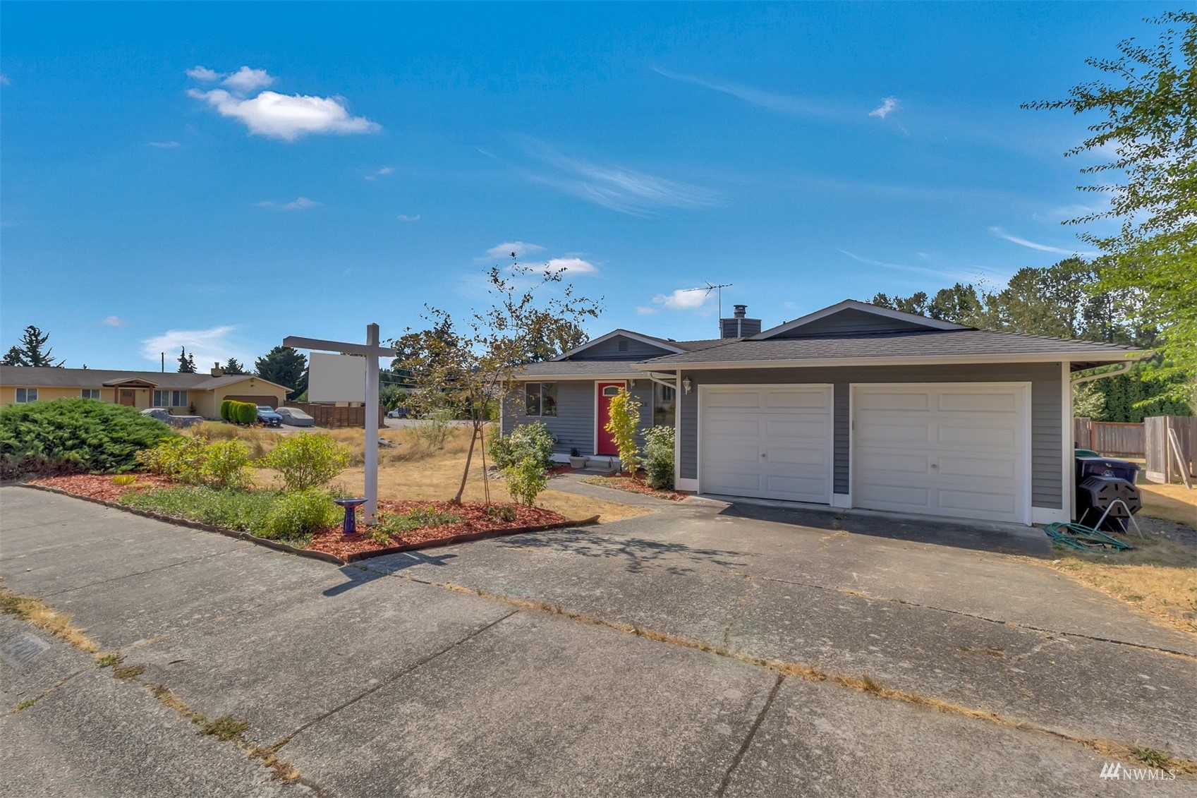 22420 13th Place West Bothell, WA 98021 - Photo 19 of 19 a view of a house with a yard and garage