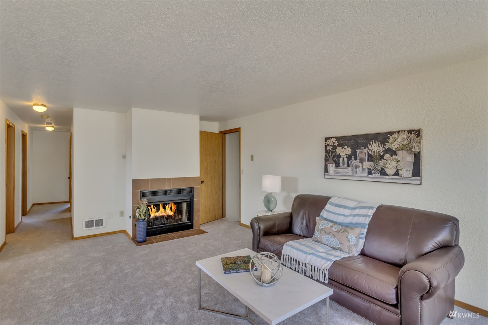 22420 13th Place West Bothell, WA 98021 - Photo 5 of 19 a living room with furniture and a fireplace