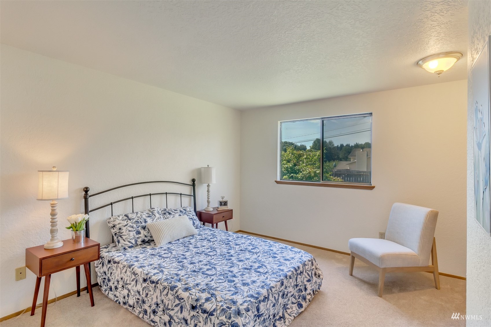 22420 13th Place West Bothell, WA 98021 - Photo 9 of 19 a bedroom with a bed and a chair