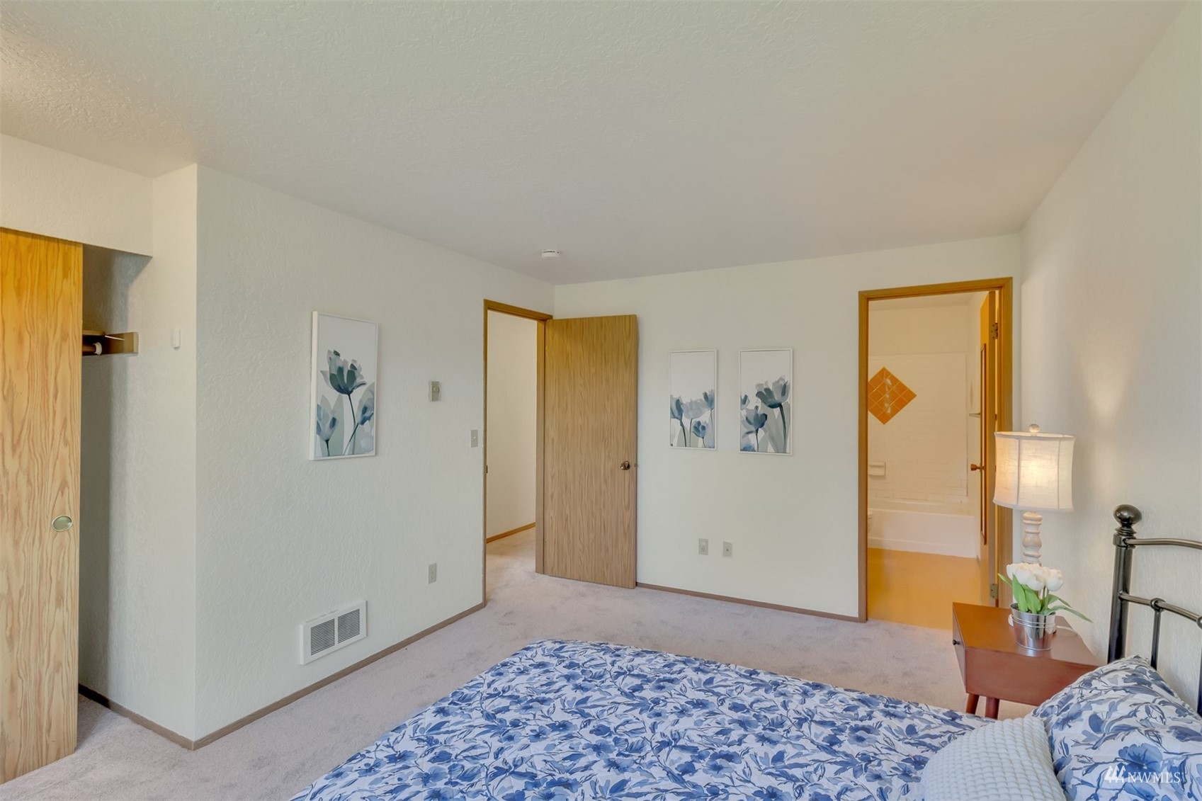 22420 13th Place West Bothell, WA 98021 - Photo 10 of 19 a view of a bedroom with wooden floor and closet