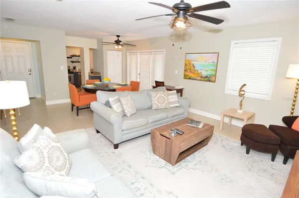 a kitchen with stainless steel appliances a stove a sink and a microwave
