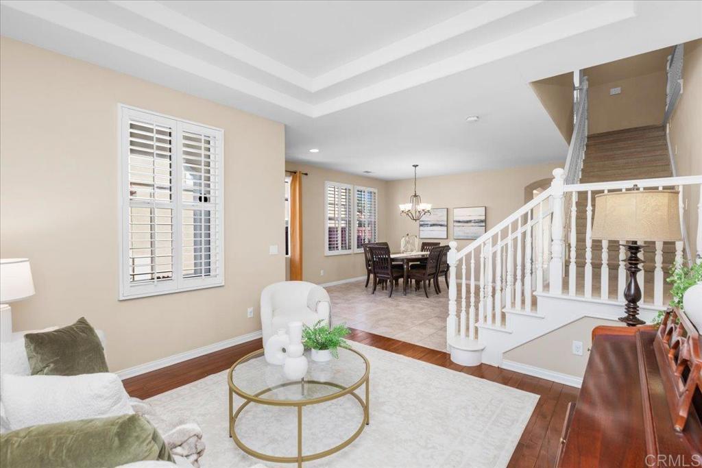 838 Luminara Way San Marcos, CA 92078 - Photo 19 of 54 a living room with furniture and wooden floor