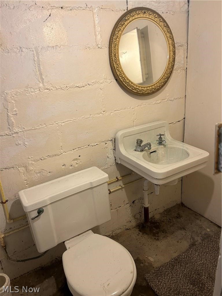 4516 Warner Road Cleveland, OH 44105 - Photo 22 of 30 Basement Bathroom with sink & toilet