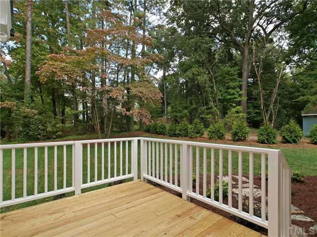 5227 Lansdowne Place Raleigh, NC 27609 - Photo 24 of 25 View of back yard from grilling deck right outside screened porch.