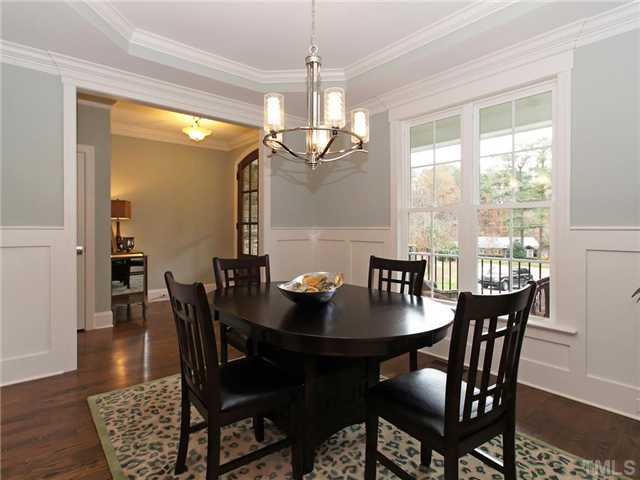 5227 Lansdowne Place Raleigh, NC 27609 - Photo 4 of 25 Dining room features wainscoatingn, crown molding and a tray ceiling.