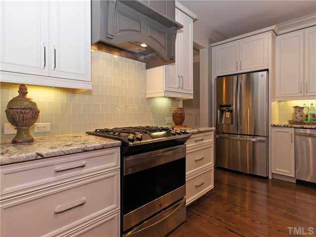 5227 Lansdowne Place Raleigh, NC 27609 - Photo 7 of 25 Gas stove with designer tile backsplash
