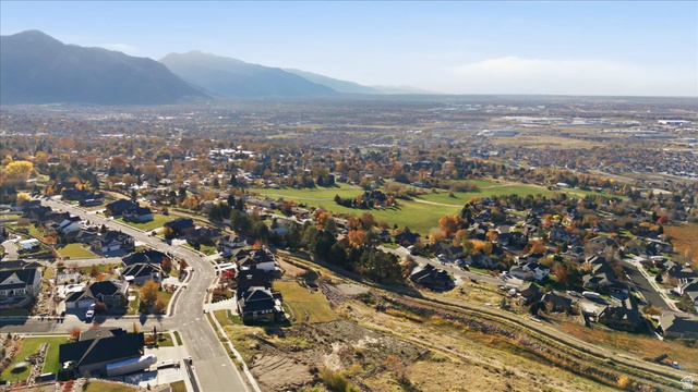 1211 West Fallow Way Ogden, UT 84414 - Photo 12 of 20 Aerial view of property and surrounding area with a mountainous background and nearby suburban area