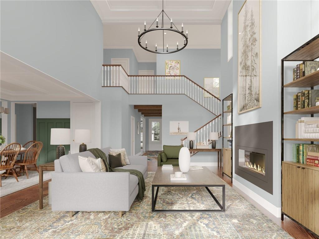 102 Ramsgate Road, Unit WEATHERBY Cranberry Township, PA 16066 - Photo 11 of 37 a living room with furniture a dining table and a chandelier