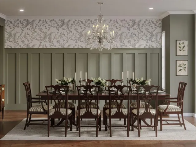 a view of a dining room with furniture and chandelier