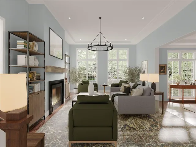 a living room with furniture a fireplace and a chandelier