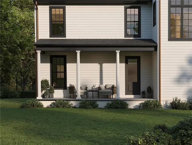 a couple of table and chairs in front of house