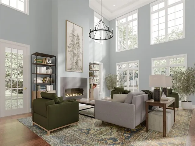 a living room with furniture a chandelier and a window