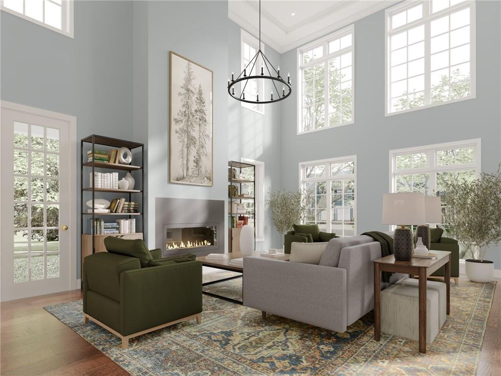 102 Ramsgate Road, Unit WEATHERBY Cranberry Township, PA 16066 - Photo 9 of 37 a living room with furniture a chandelier and a window