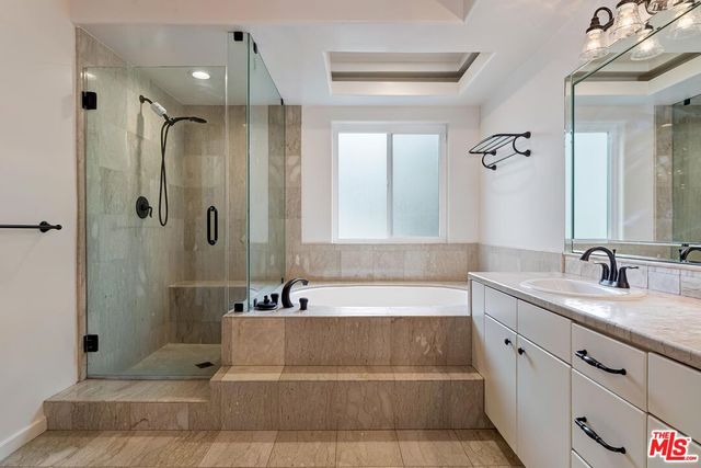 a view of a hallway with workspace and entryway