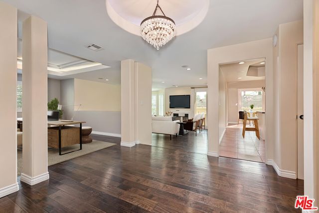 a view of livingroom with dining room and wooden floor