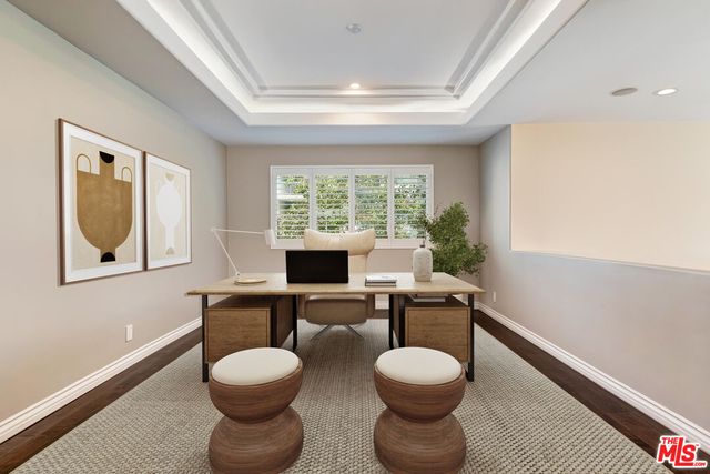 a view of a room with a table and chairs