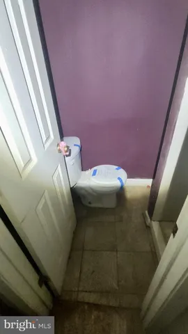 a bathroom with a toilet and a sink