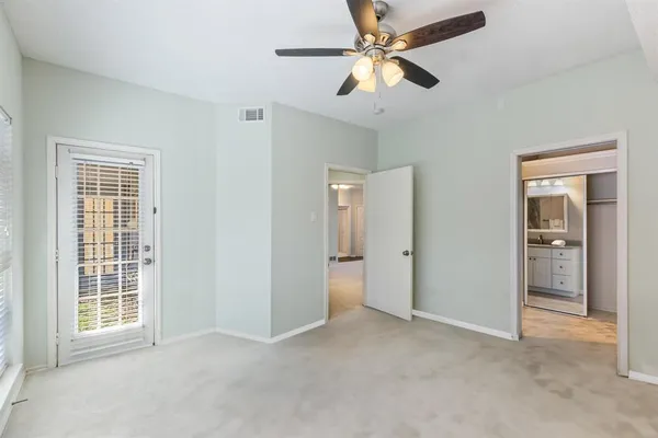 a bedroom with furniture and windows