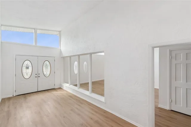 a view of front door with wooden floor