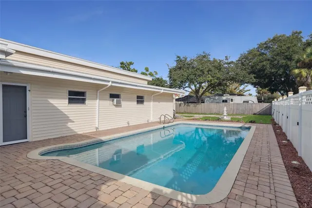 a view of a house with backyard