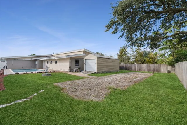 a view of a yard with a house and garden