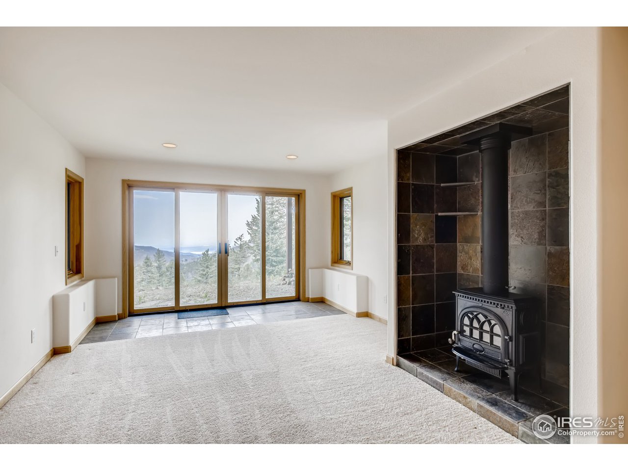 98 Rim Road Boulder, CO 80302 - Photo 16 of 31 a view of an empty room and window