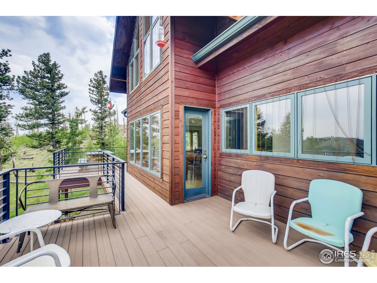 98 Rim Road Boulder, CO 80302 - Photo 25 of 31 a balcony with table and chairs